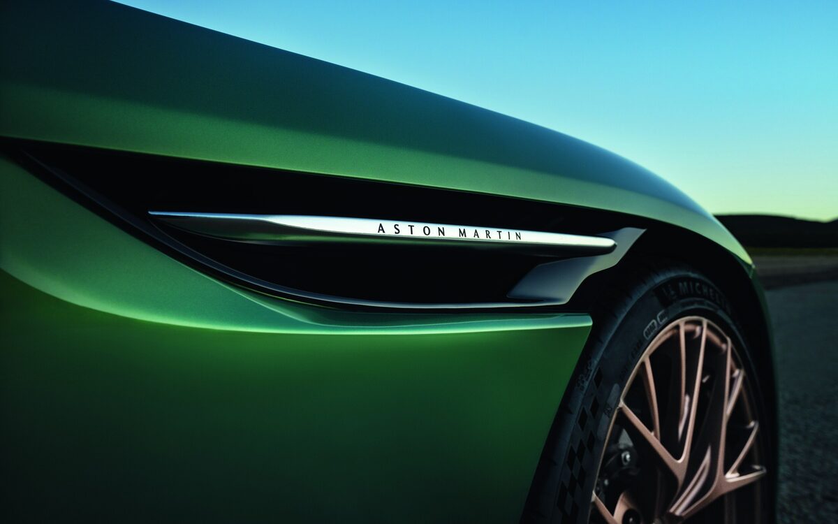 Close-up of the DB12 front wing vent with Aston Martin lettering and wheel