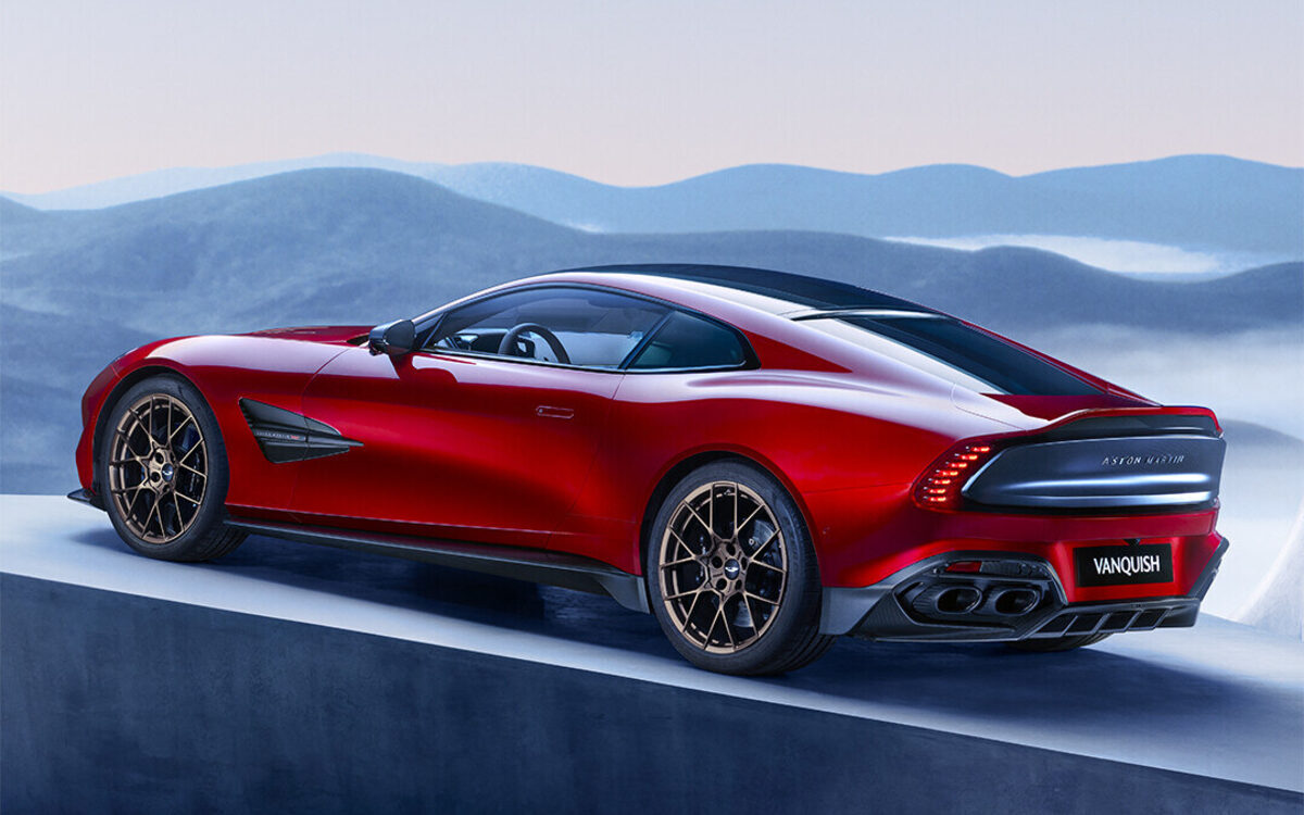 Red Aston Martin Vanquish on a plinth, rear three-quarter view