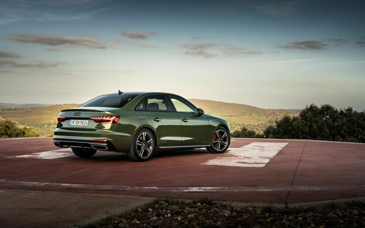 Audi A4 in District Green, rear three-quarter view