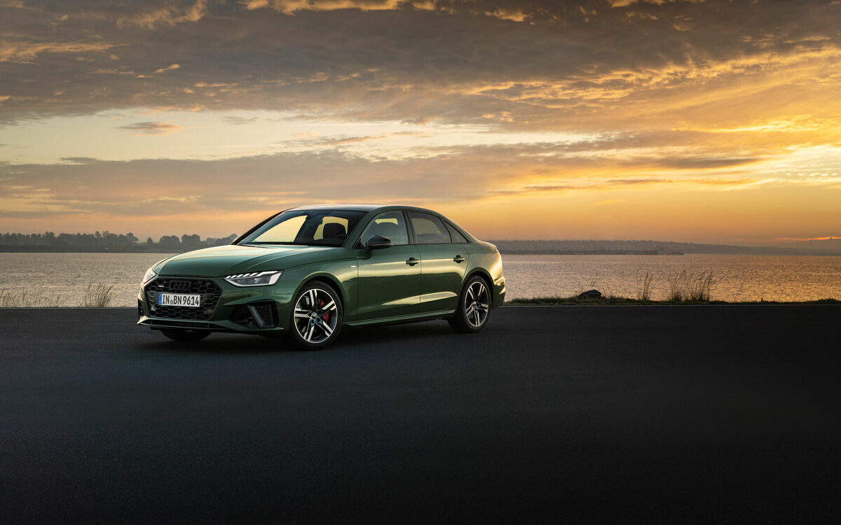 Audi A4 in District Green parked at sunset, front three-quarter view
