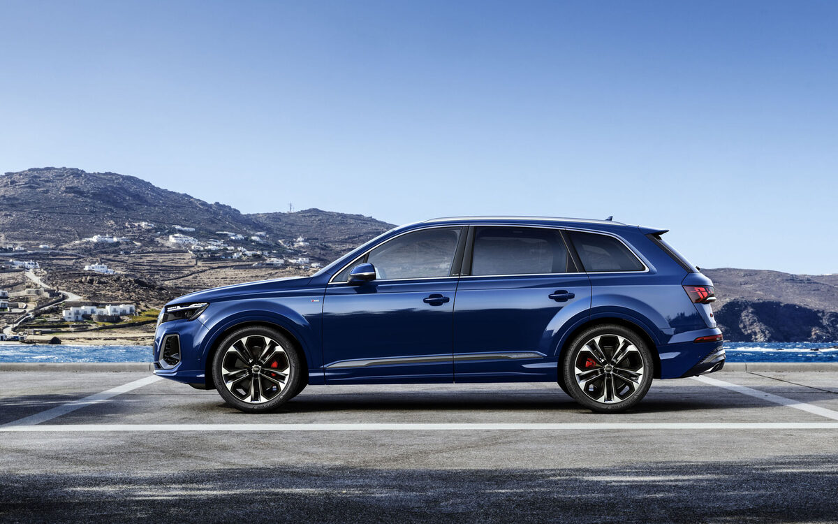 Audi Q7 in Ascari Blue, full side profile by the coast