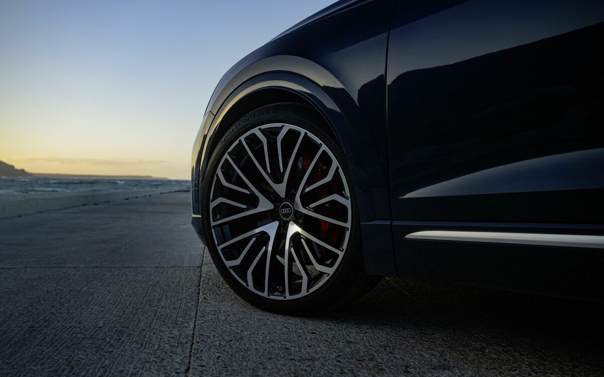 Audi SQ8 in Waitomo Blue, close-up of a large multi-spoke alloy wheel with red brake caliper