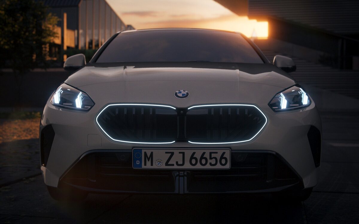 Front view of the BMW 2 Series Gran Coupe with the illuminated kidney grille and headlamps on