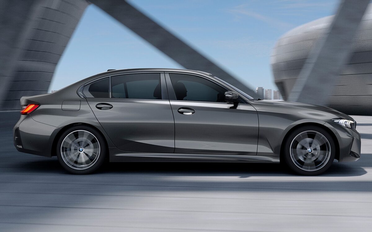 BMW 3 Series Long Wheelbase in grey, side profile driving under a bridge