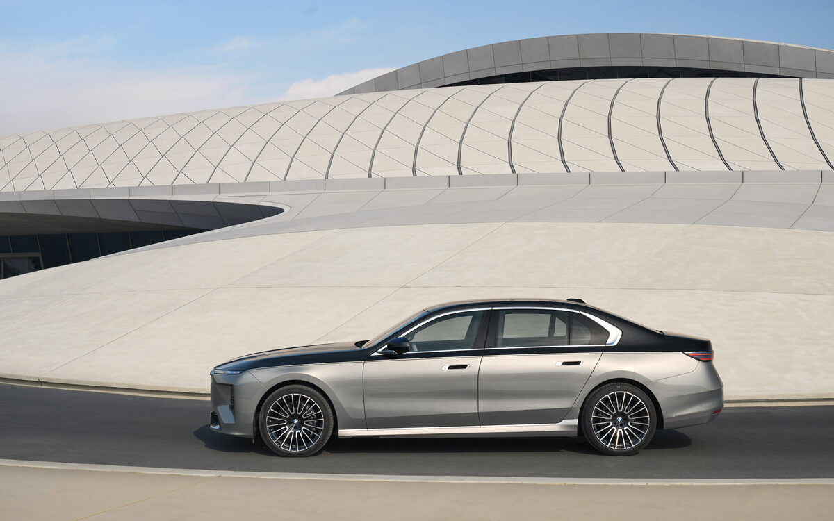 BMW 7 Series side profile with dual-tone paint and multi-spoke alloy wheels