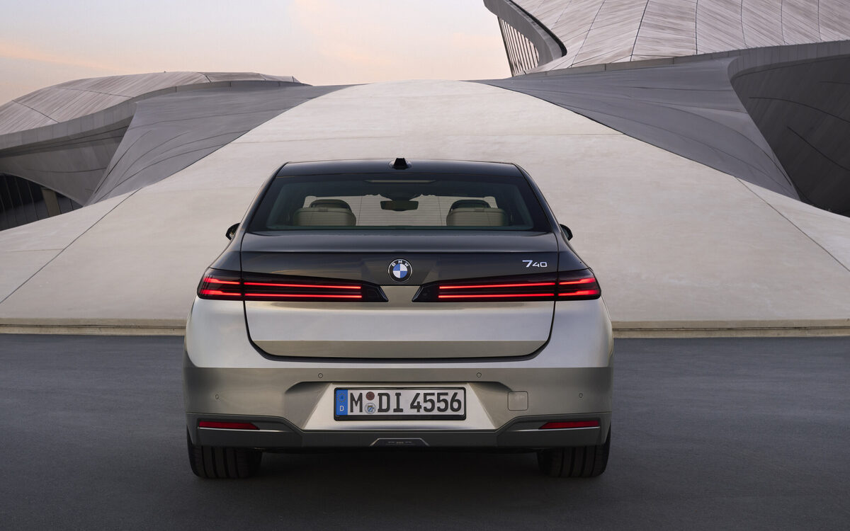 BMW 7 Series seen from directly behind, showing the slim LED tail lamps and boot lid