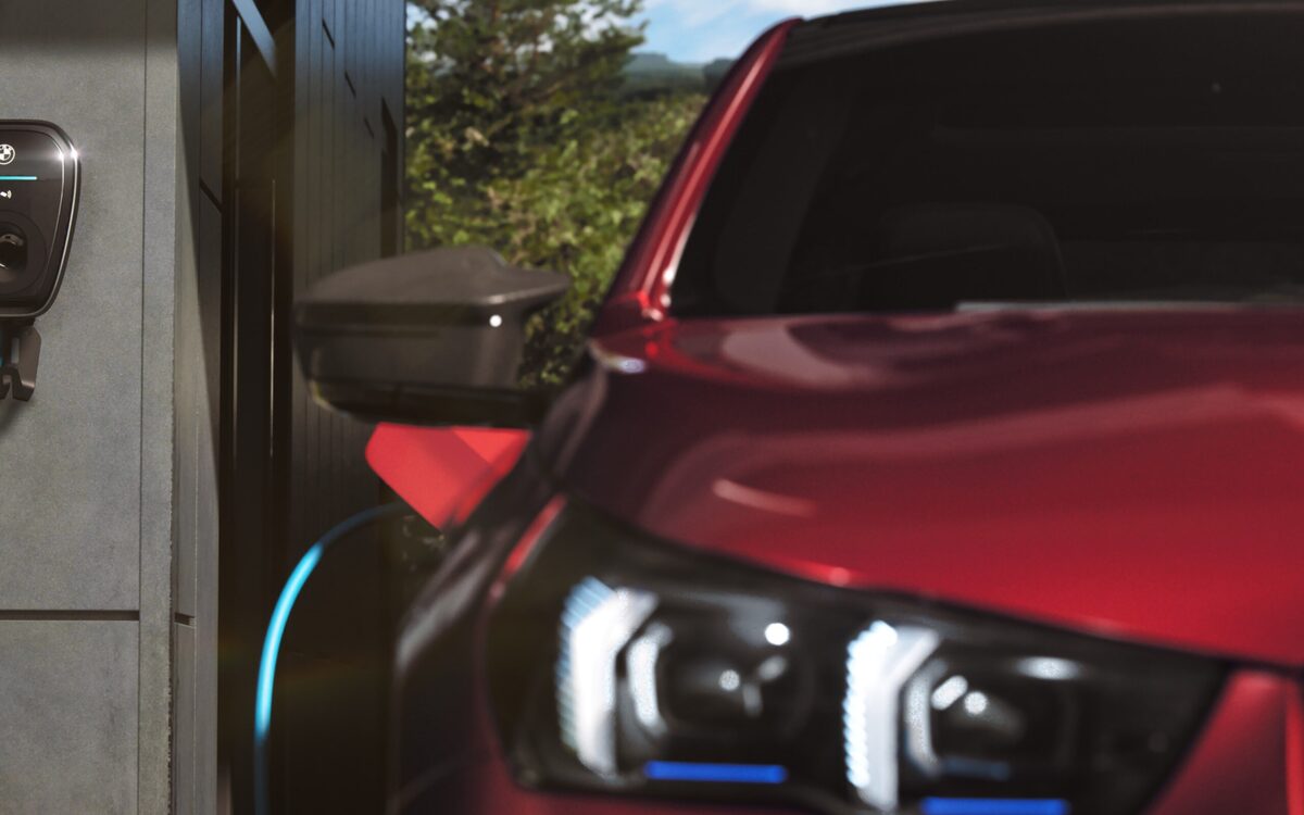 LED headlamp and charging cable on the red BMW i5
