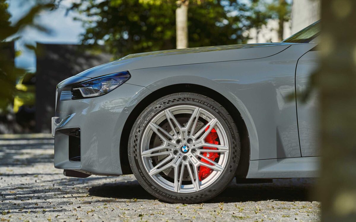Close-up of the M2 front alloy wheel with red brake caliper