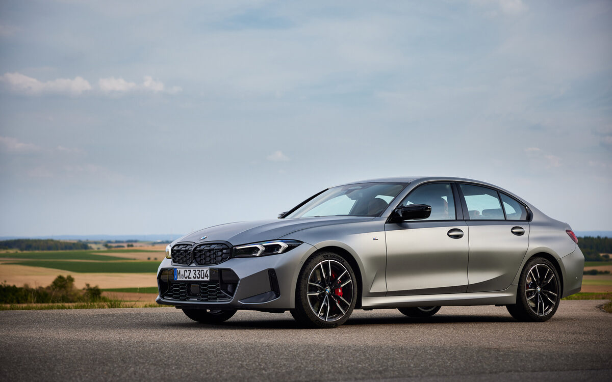 BMW M340i xDrive in grey parked on a road, seen from the front side