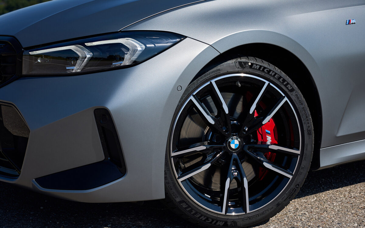 Close-up of the M340i alloy wheel with red M brake caliper