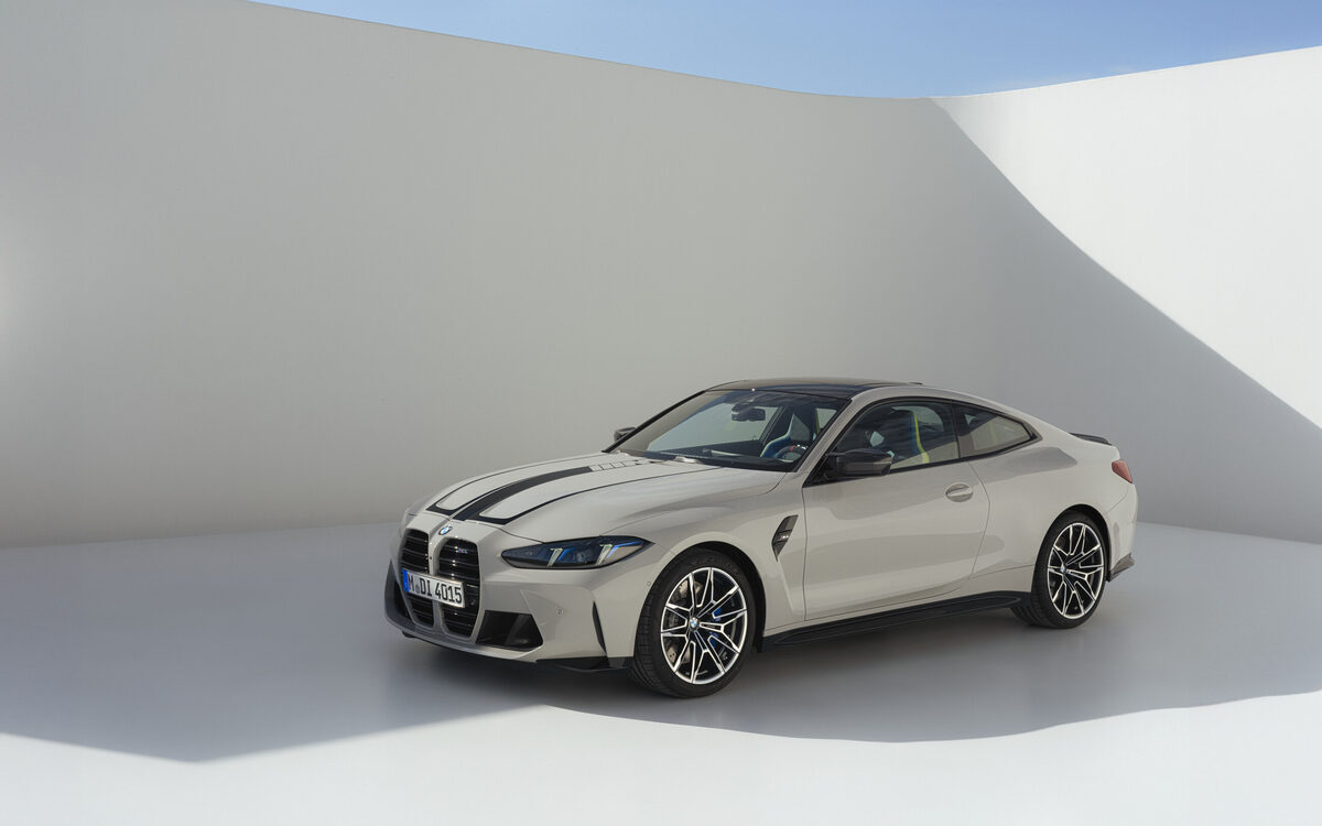 BMW M4 Competition in a studio setting, front three-quarter view