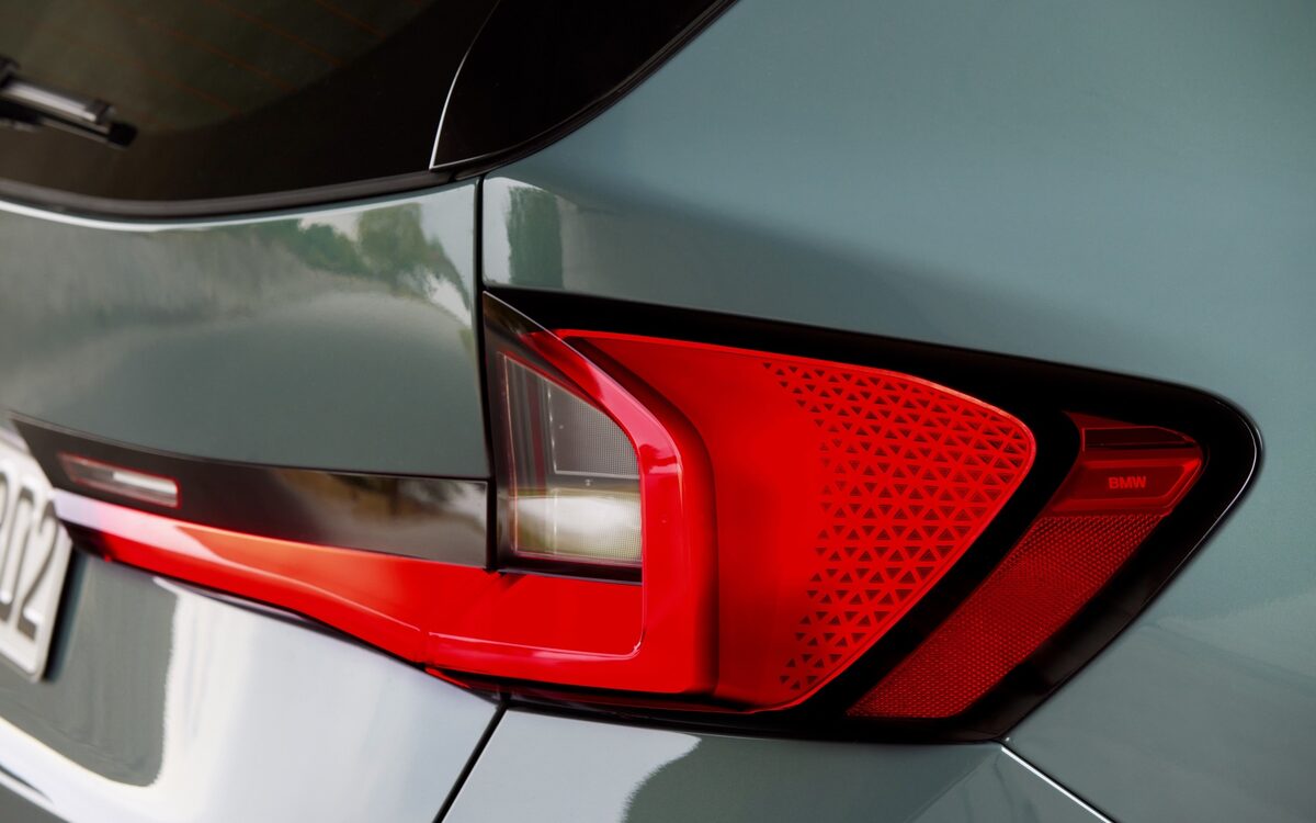 Close-up of the red LED tail lamp with patterned lens on the BMW X1