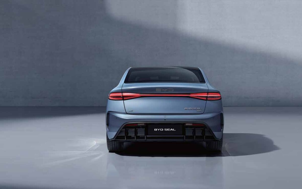 BYD Seal in blue-grey seen directly from behind, showing the full-width LED tail light strip