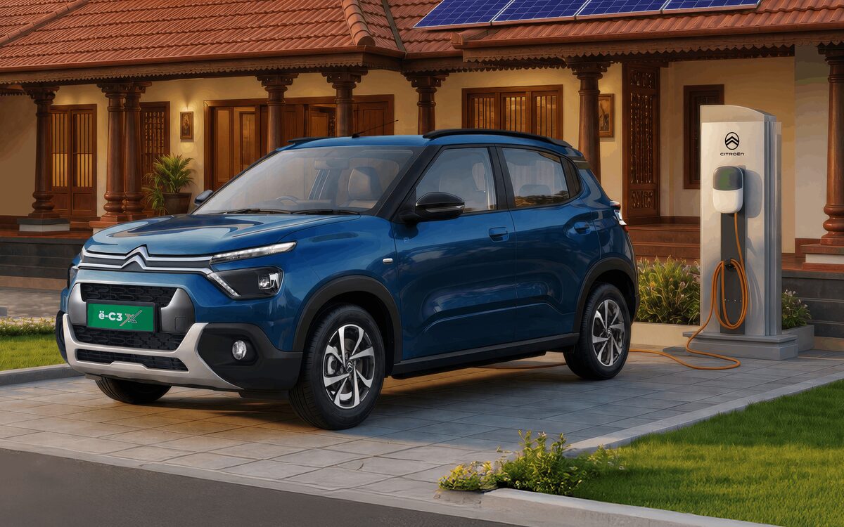 Blue Citroen eC3 parked in front of a house next to an EV wall charger