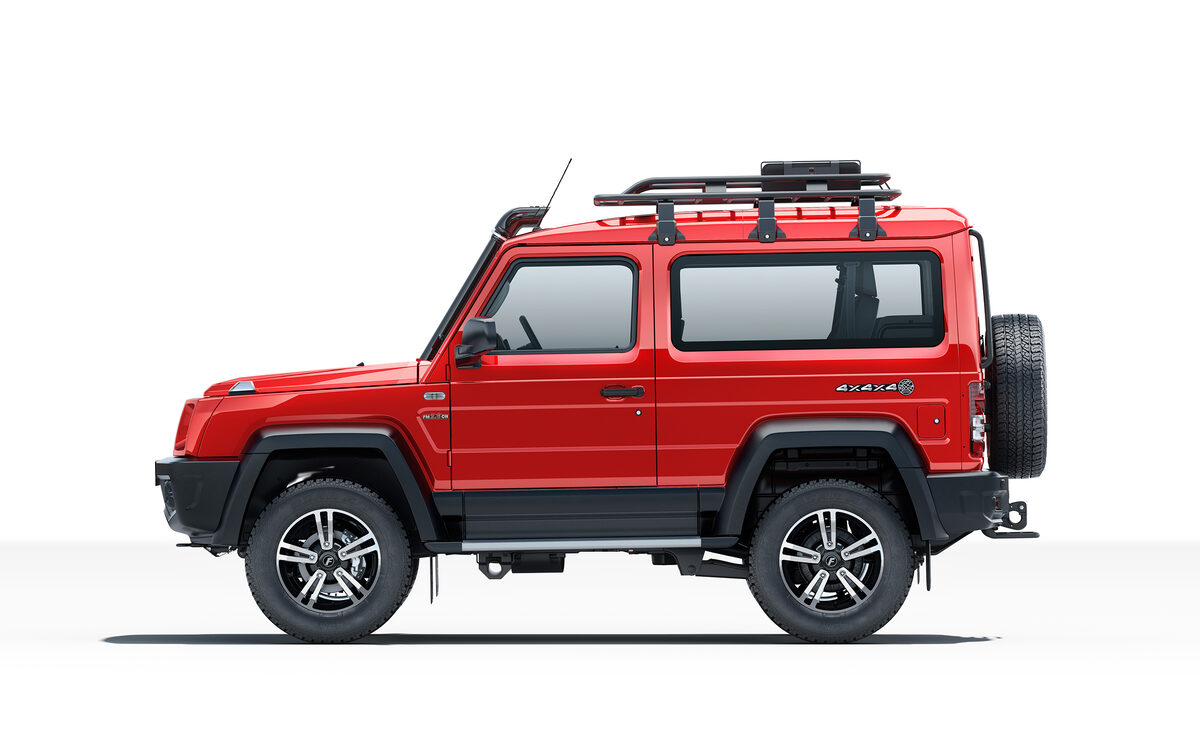Force Gurkha 3-door in red, side profile on a white studio background