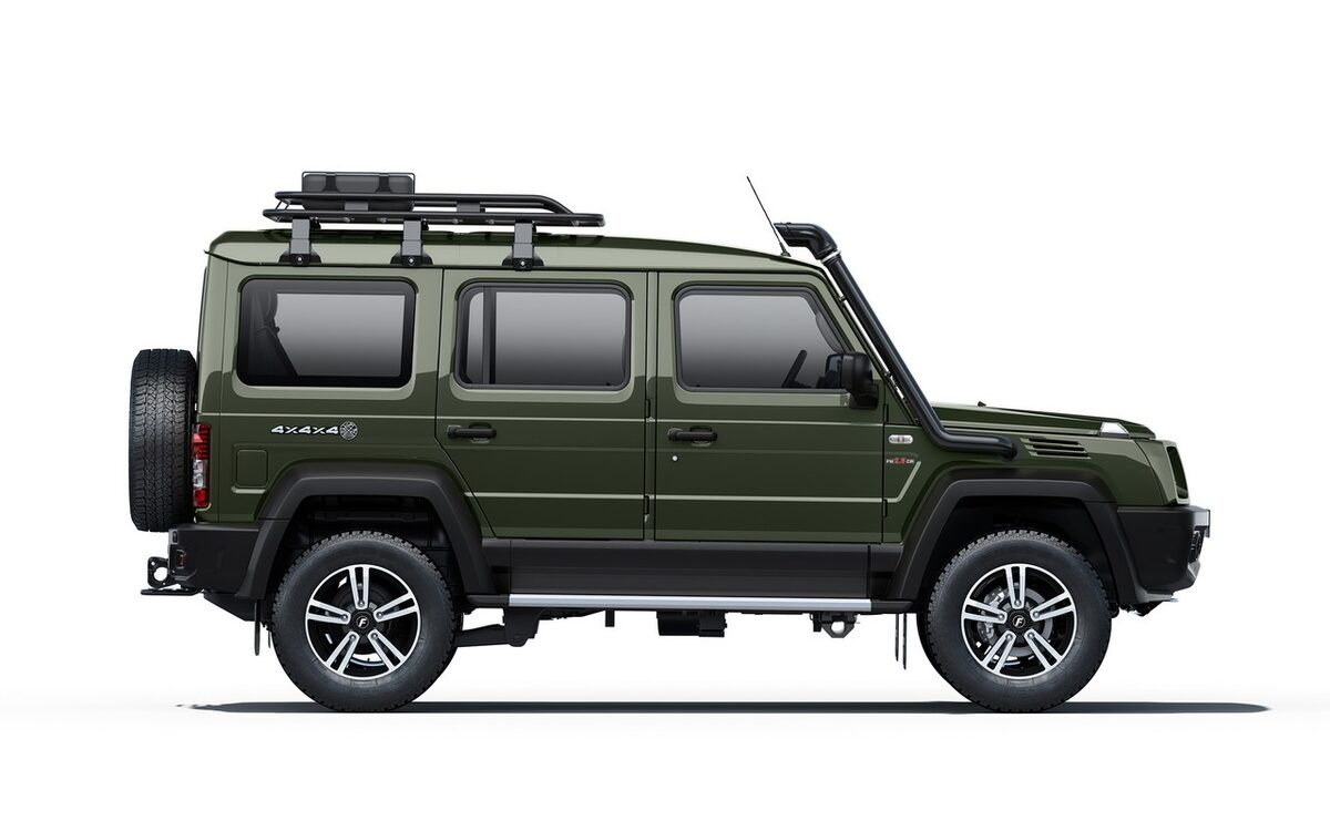 Force Gurkha 5-door in green, rear three-quarter side view with spare wheel and snorkel