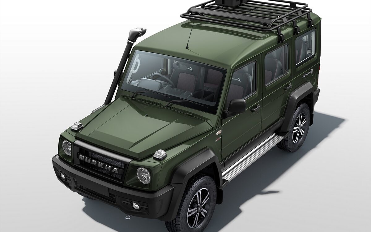 Force Gurkha 5-door in green seen from a high front three-quarter angle with the roof rack