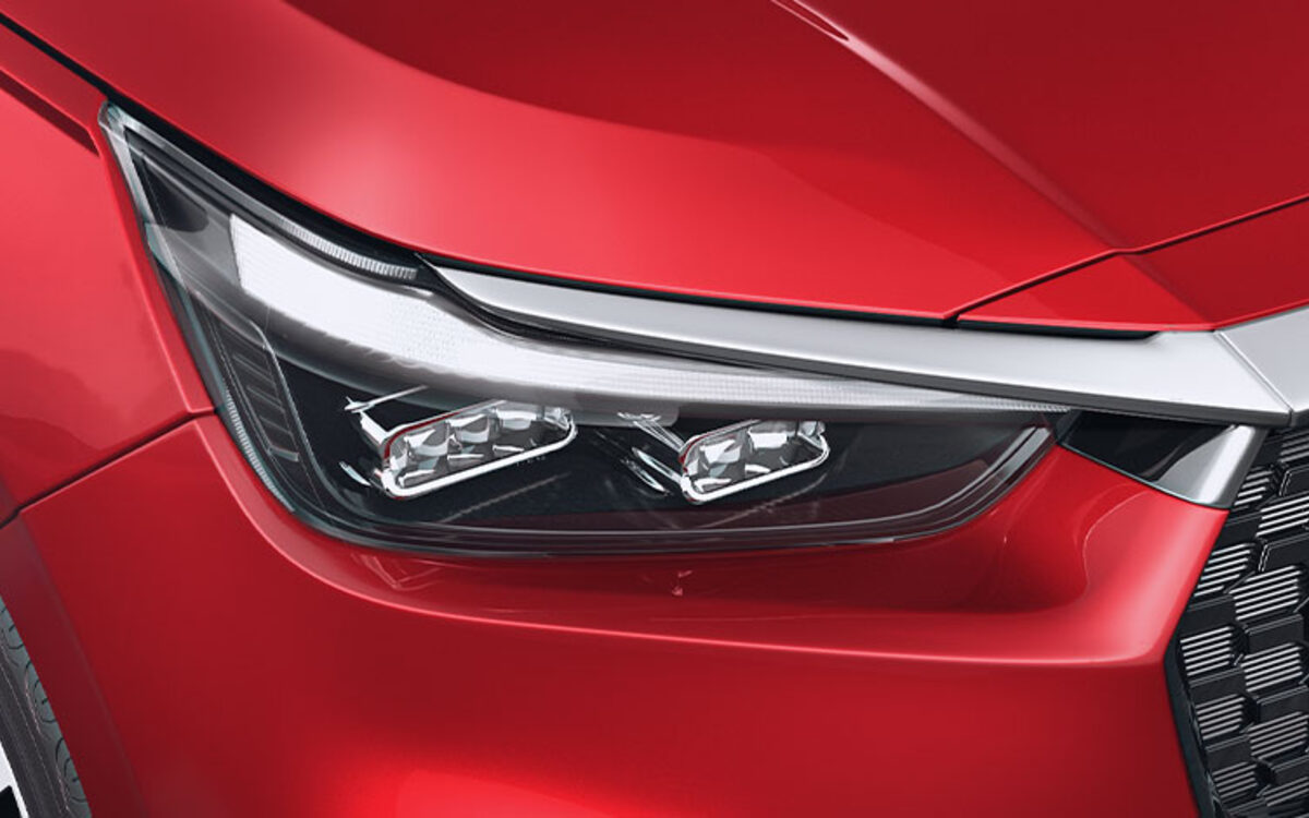 Close-up of the Honda Amaze LED headlamp and grille corner