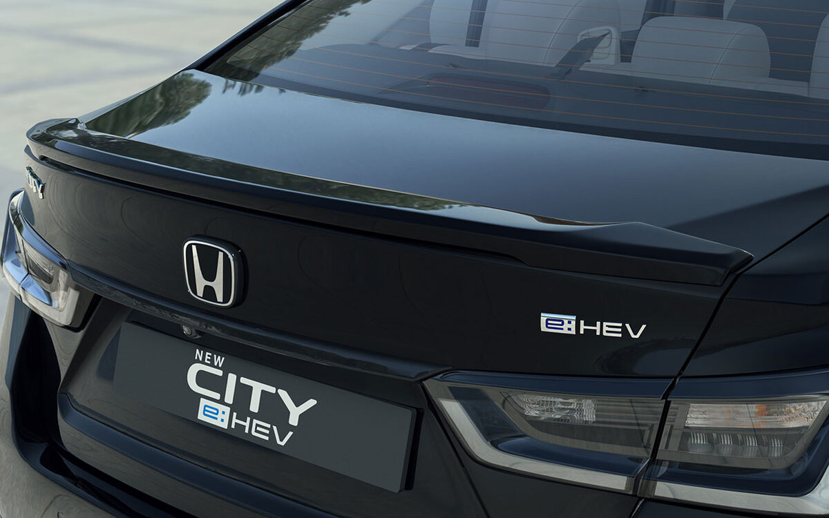 Rear of the black Honda City e:HEV showing the boot lip spoiler, badge and tail lamp