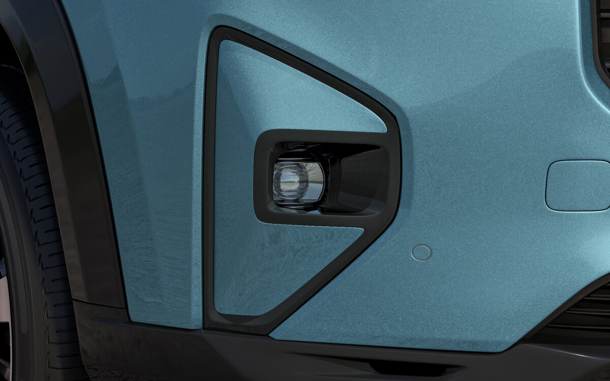 Close-up of the Honda Elevate fog lamp housing in the front bumper of a teal car