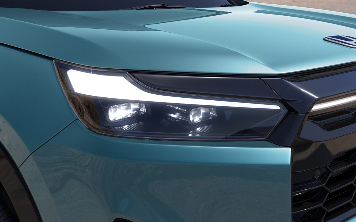 Close-up of the Honda Elevate LED headlamp and light signature on a teal car