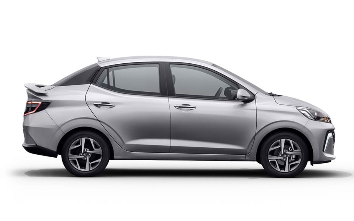 Hyundai Aura in silver, side profile on a white background