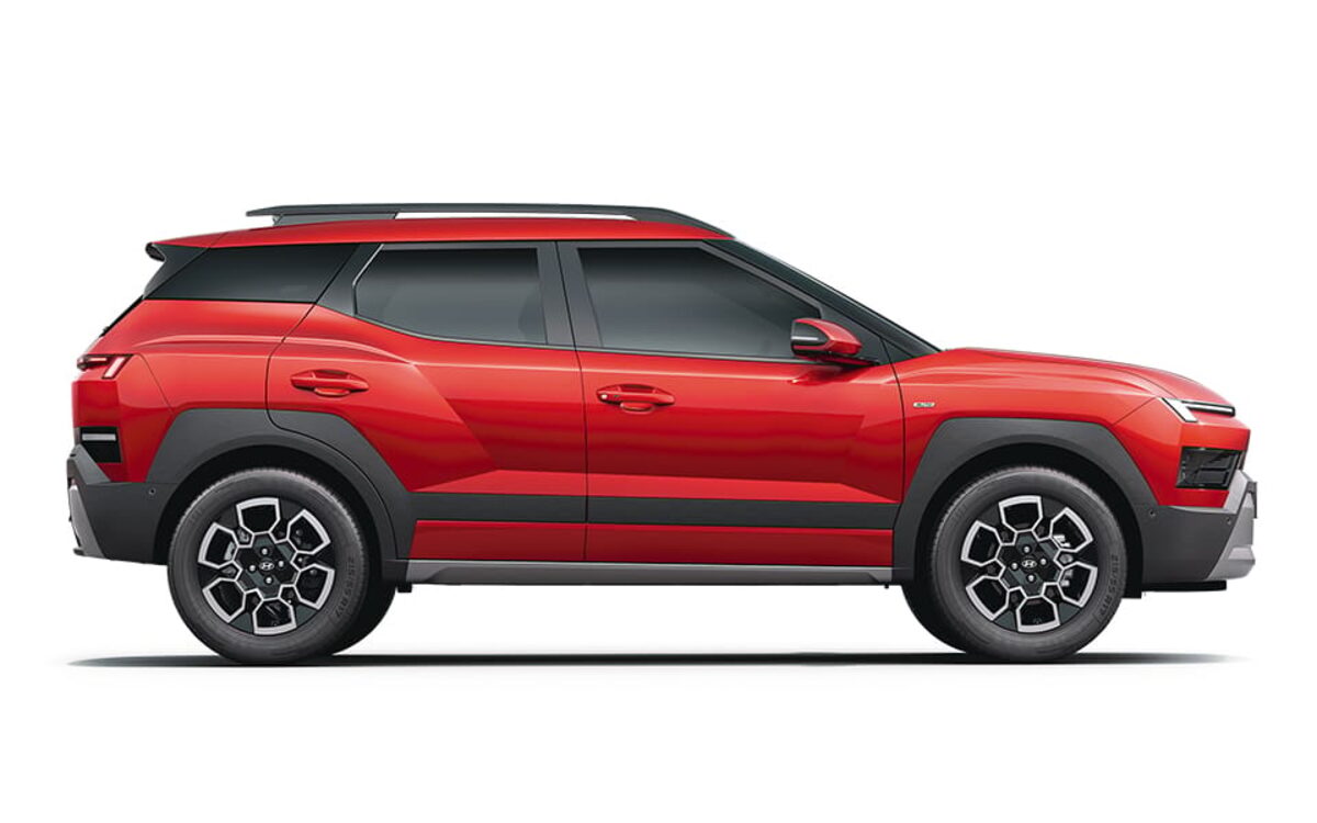 Hyundai Bayon side profile in Fiery Red on a white background