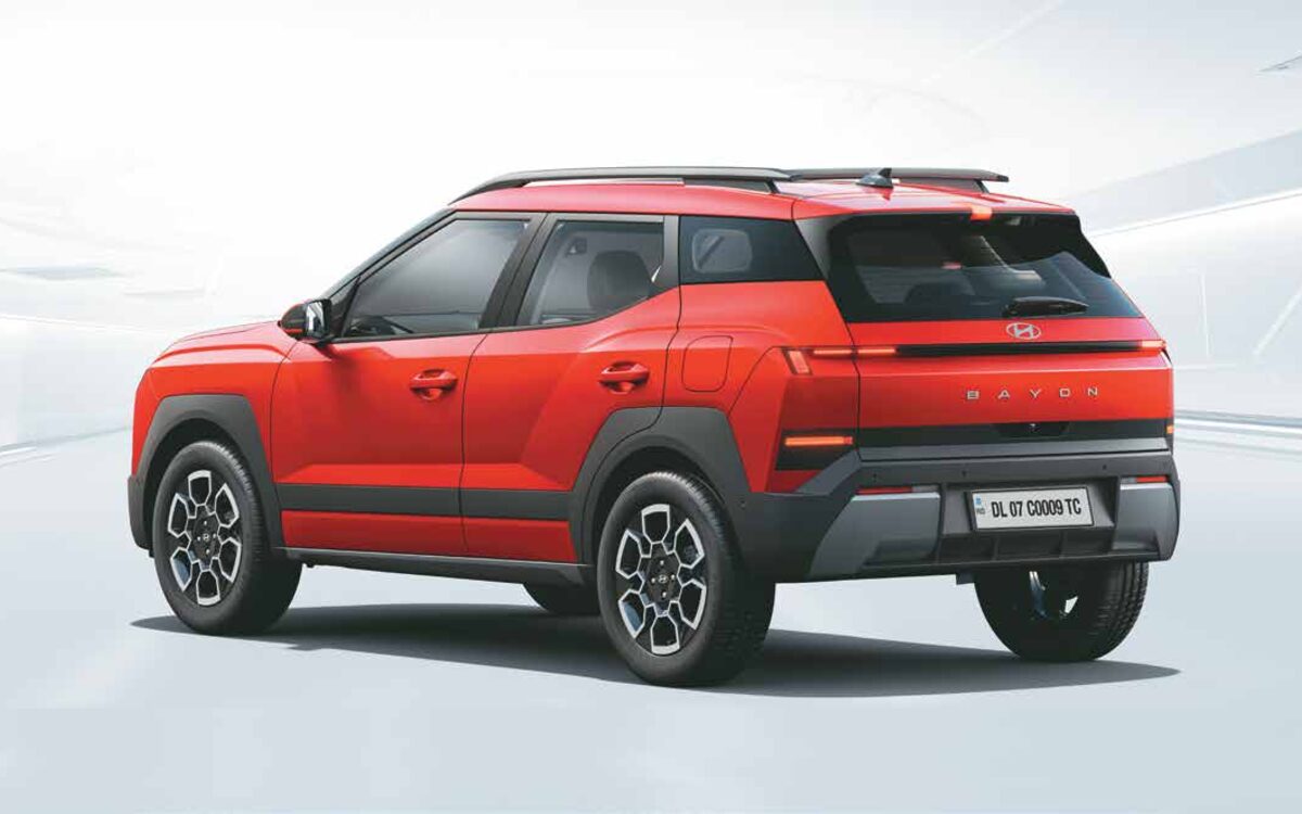 Hyundai Bayon rear three-quarter studio view in Fiery Red