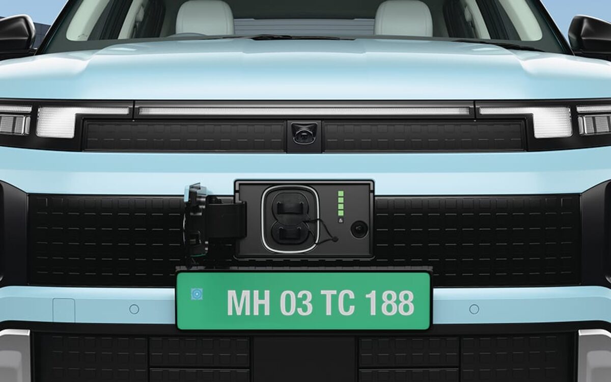 Close-up of the Hyundai Creta Electric front grille with the charging port flap open