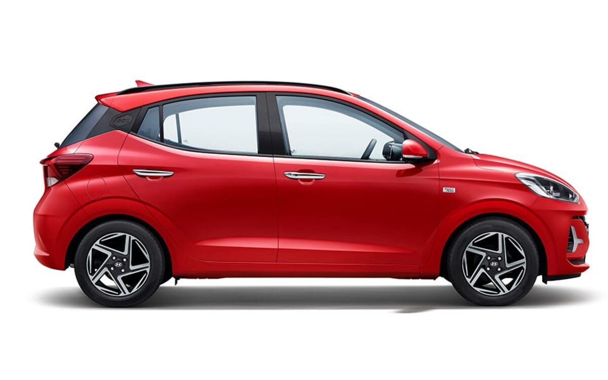 Hyundai Grand i10 Nios in red, side profile on a white background
