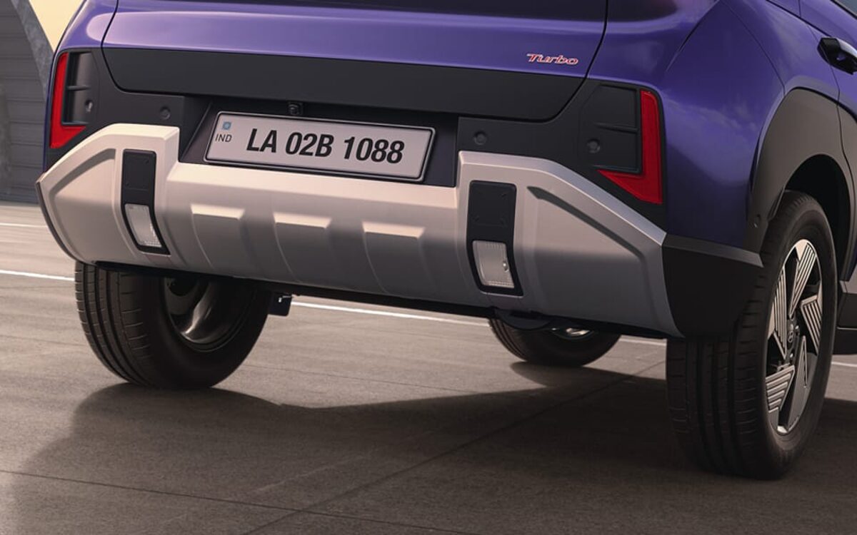 Close-up of the Venue's rear bumper, skid plate and tail lamp on a road