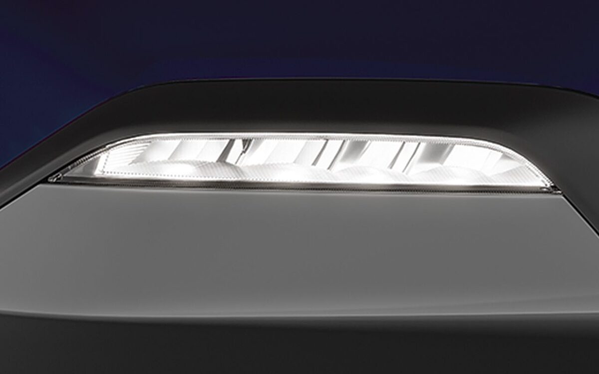 Close view of the Kia Sonet LED fog lamp in the front bumper of a blue car
