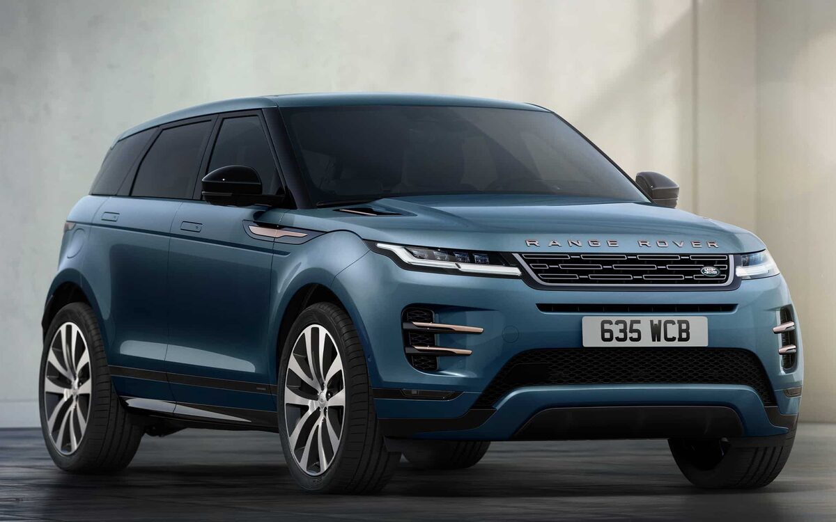 Range Rover Evoque in blue parked beside a concrete wall, seen from the front