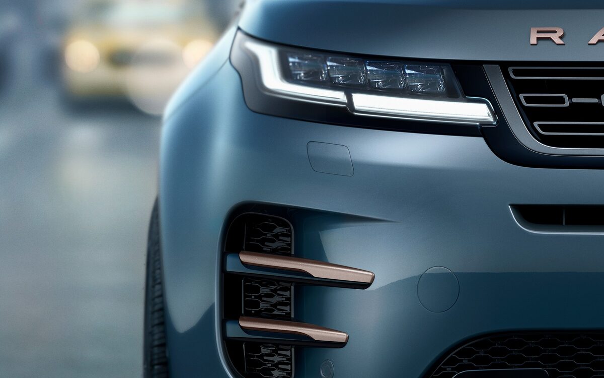 Close-up of the Range Rover Evoque LED headlamp, grille and copper side vent