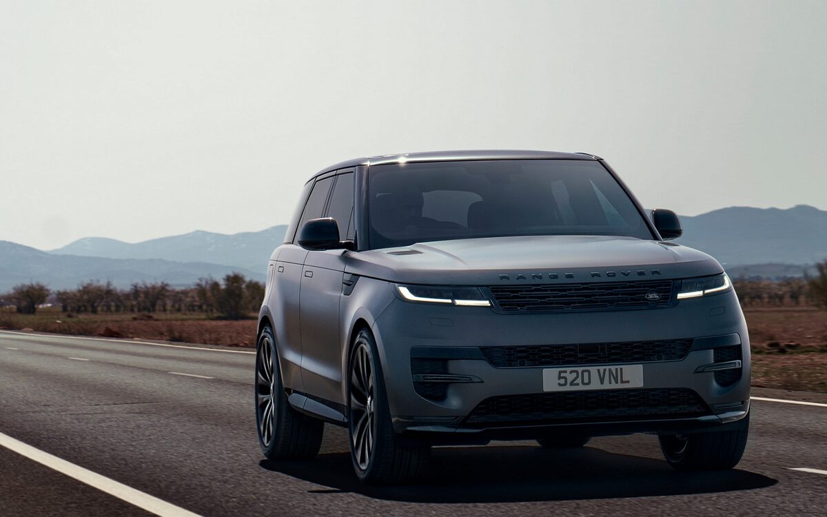 Range Rover Sport in grey driving on a mountain road, front view