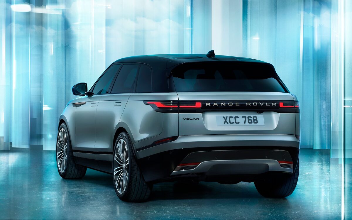 Range Rover Velar in grey, rear three-quarter view showing the tail lamps and number plate