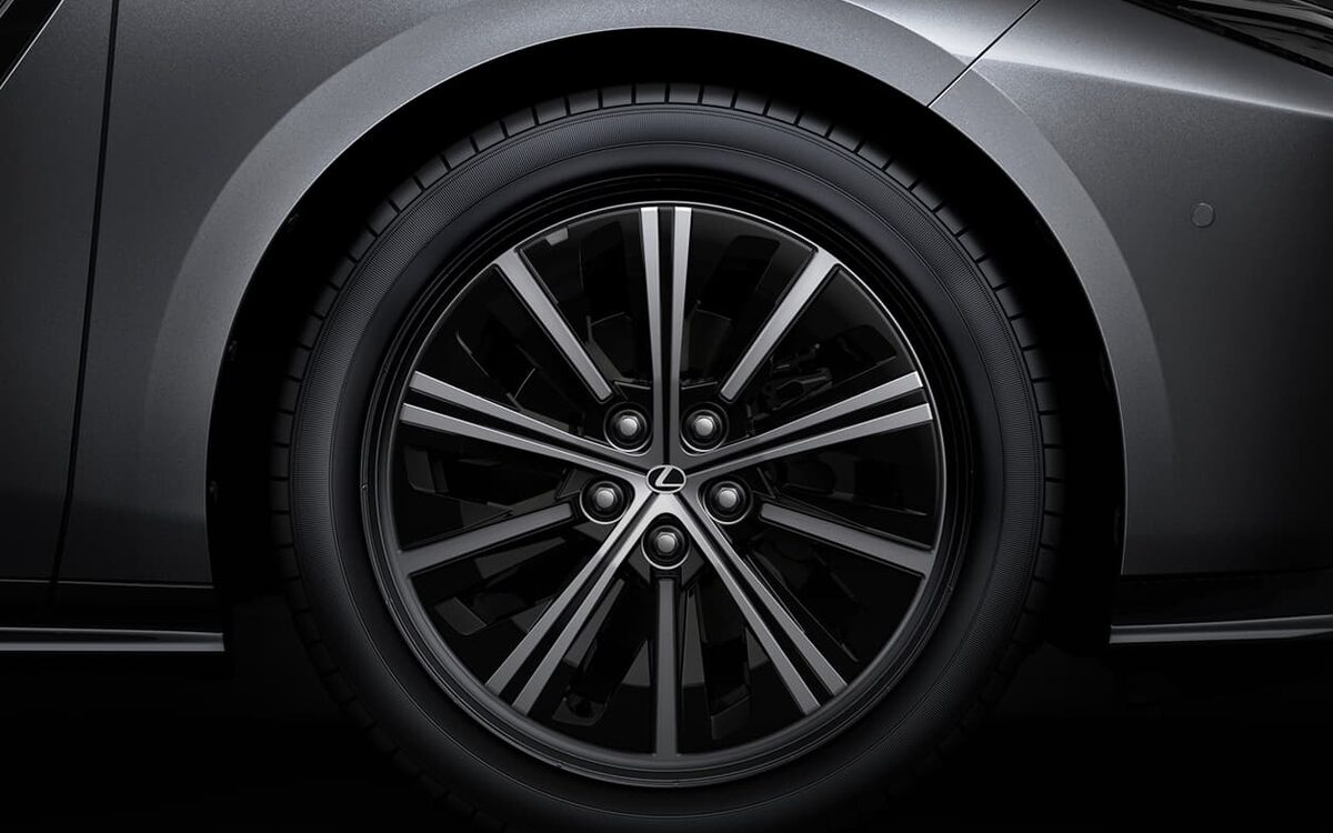 Close-up of a Lexus ES 19-inch alloy wheel in a dark studio