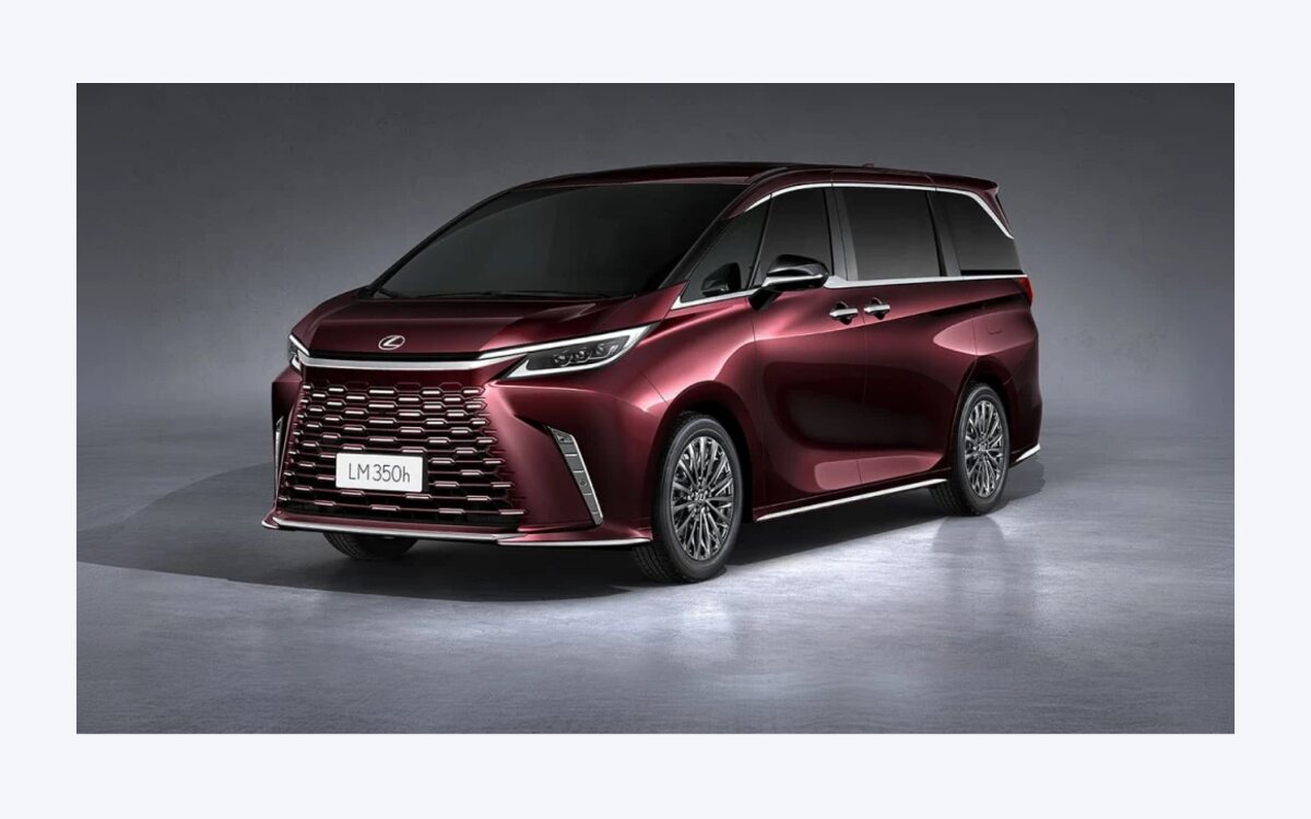Maroon Lexus LM 350h seen from the front three-quarter in a studio with the spindle grille