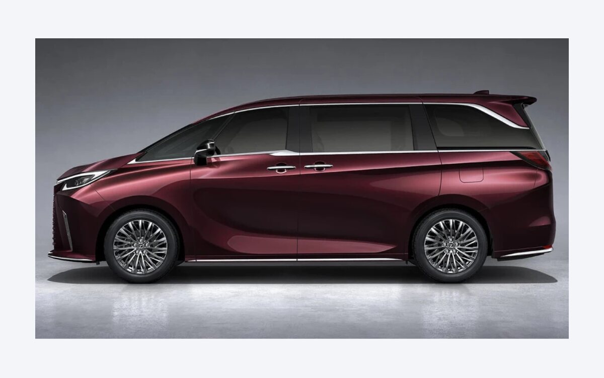 Side profile of a maroon Lexus LM 350h in a studio