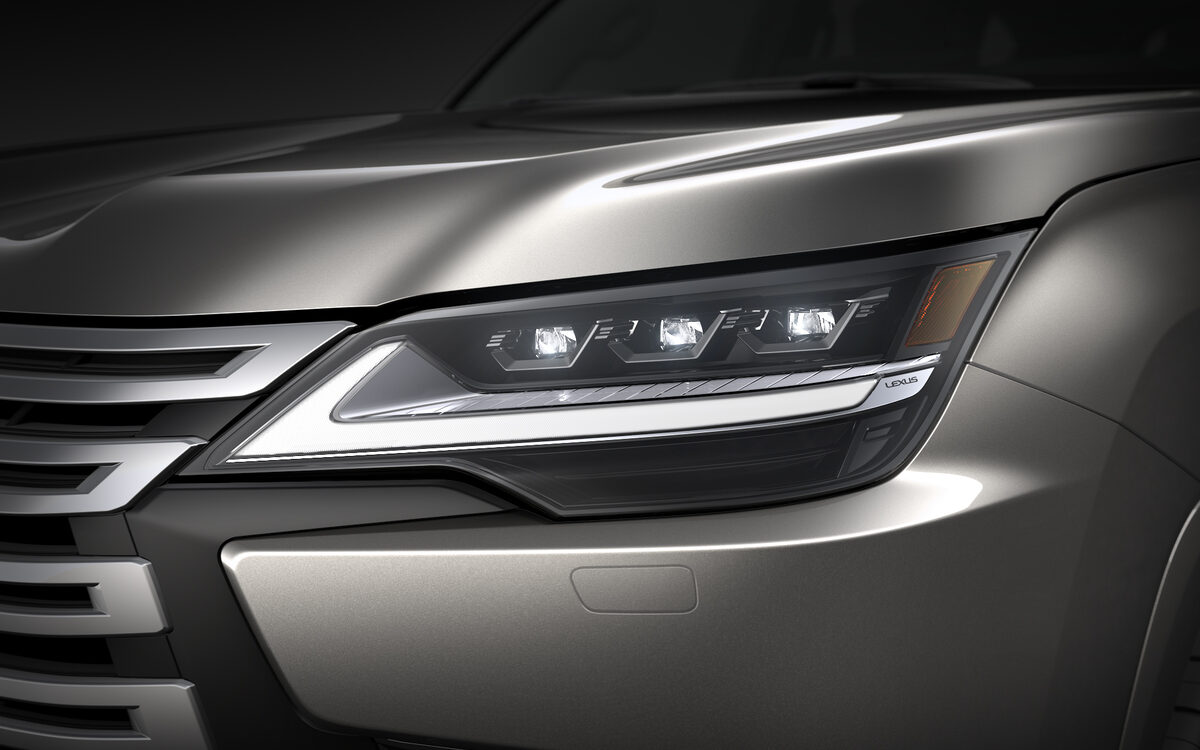 Close-up of the Lexus LX triple-LED headlamp and grille slats