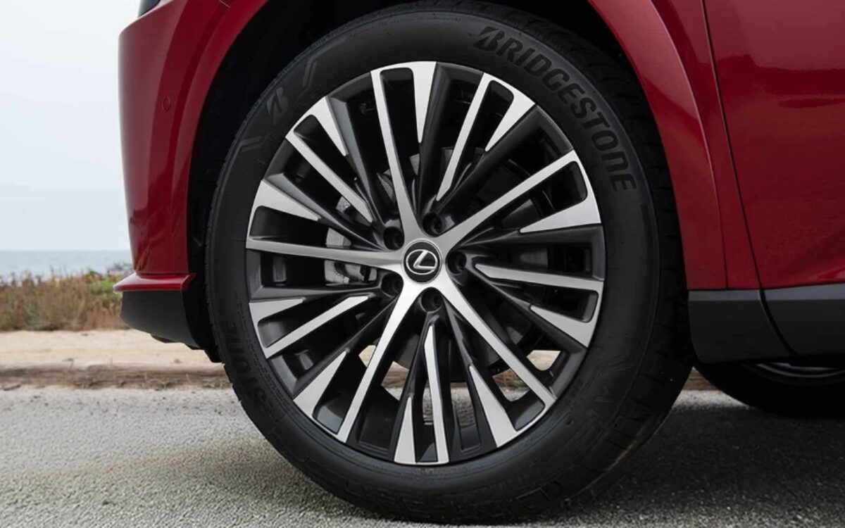 Close-up of the Lexus RX multi-spoke alloy wheel on a red car