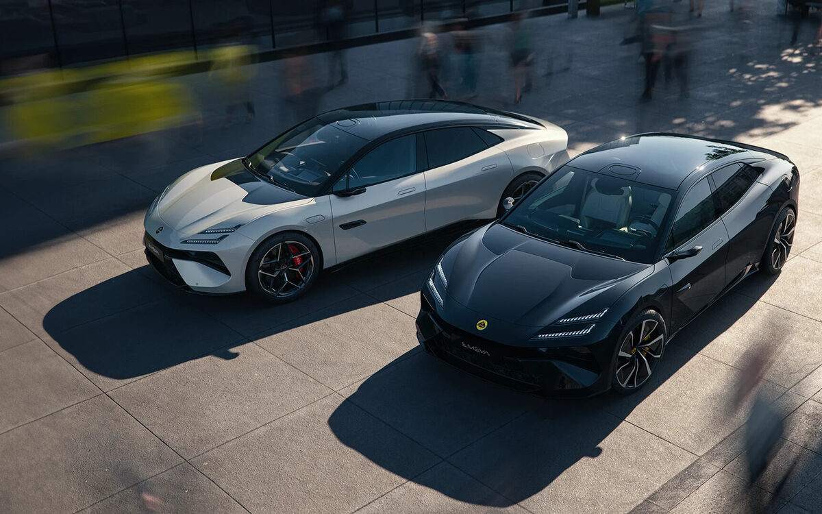 Two Lotus Emeya cars in white and black seen from above on a paved street