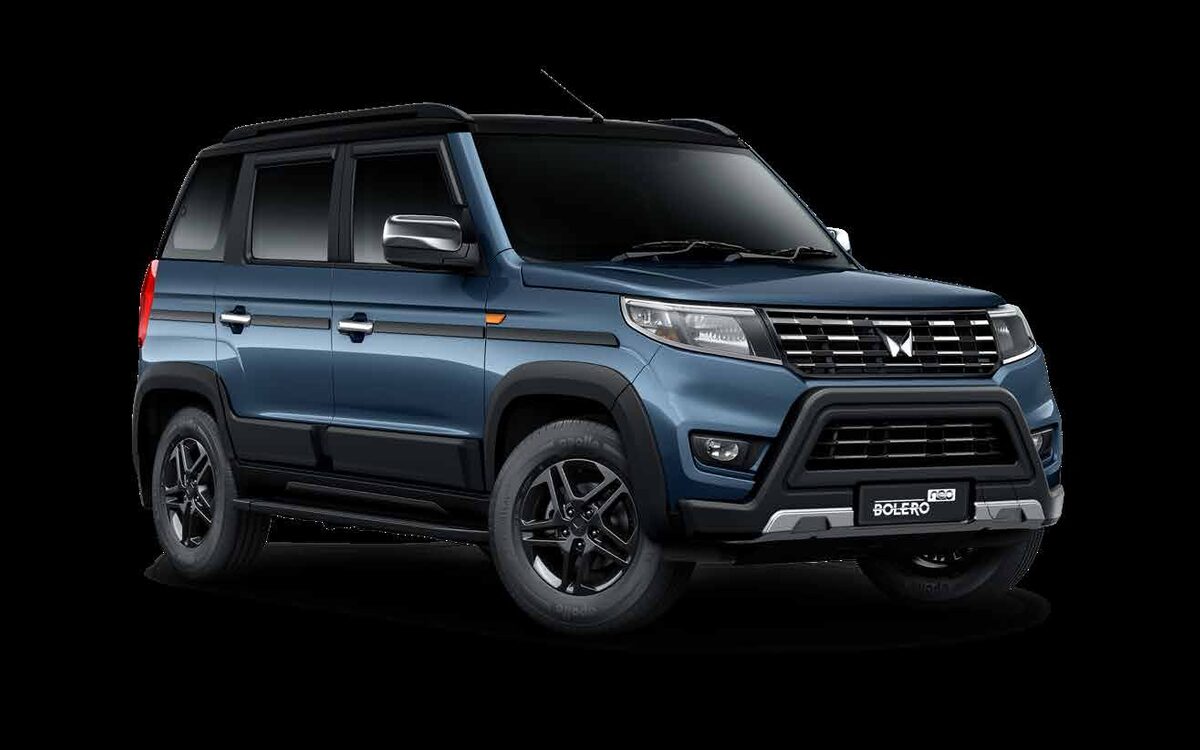 Mahindra Bolero Neo in Jeans Blue with black roof and black alloy wheels on a black studio background, front three-quarter view
