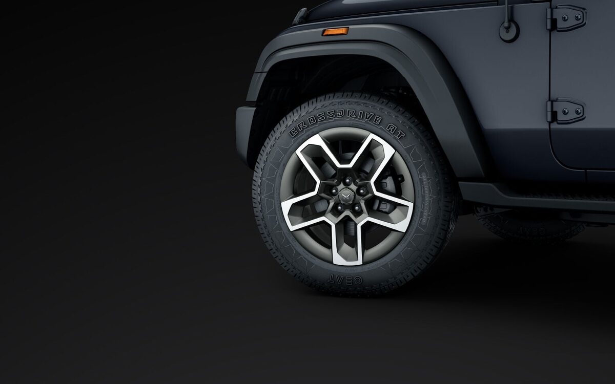 Close-up of the Mahindra Thar front alloy wheel, wheel arch and door hinges