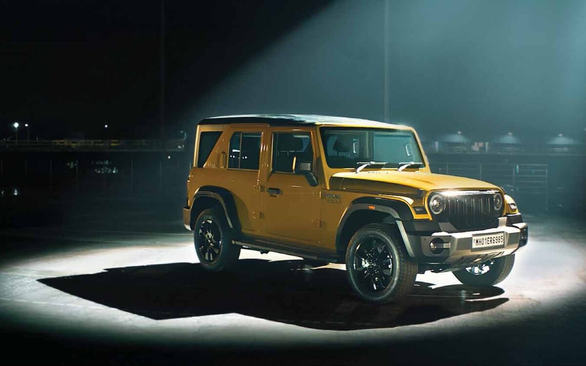 Yellow Thar ROXX lit by a single spotlight at night