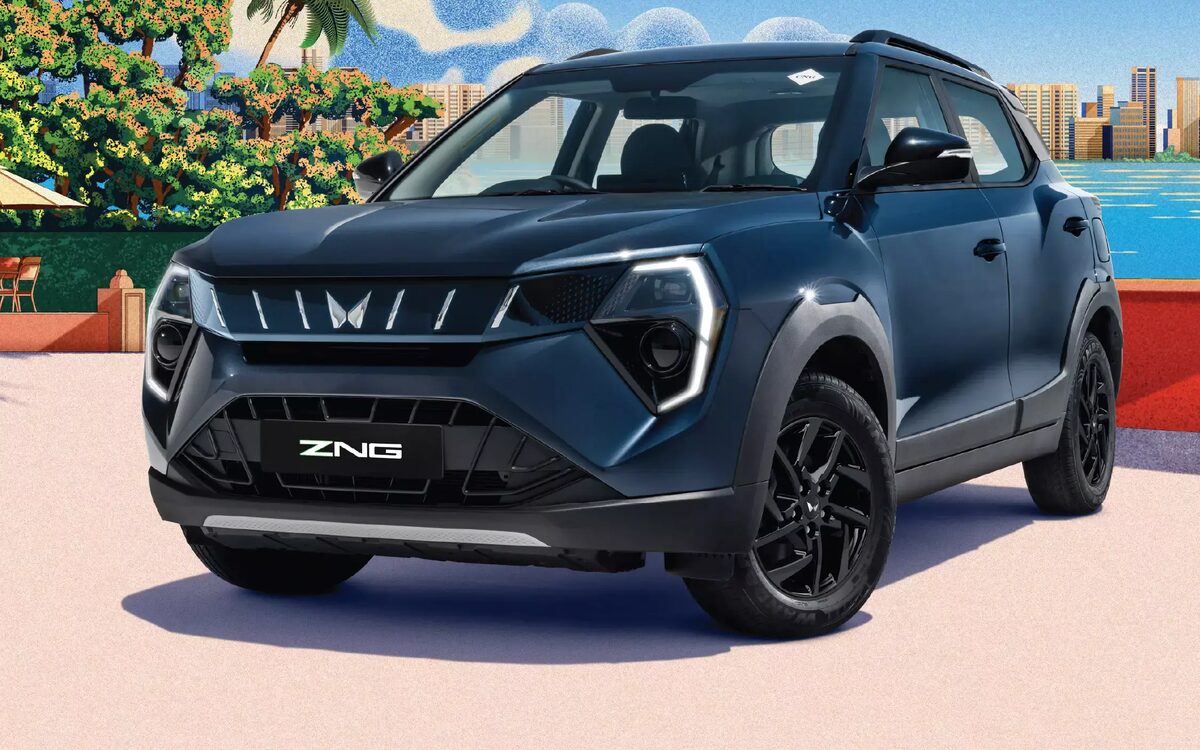 Dark blue Mahindra XUV 3XO ZNG (CNG) with lit headlamp signature, front three-quarter view on a seaside terrace