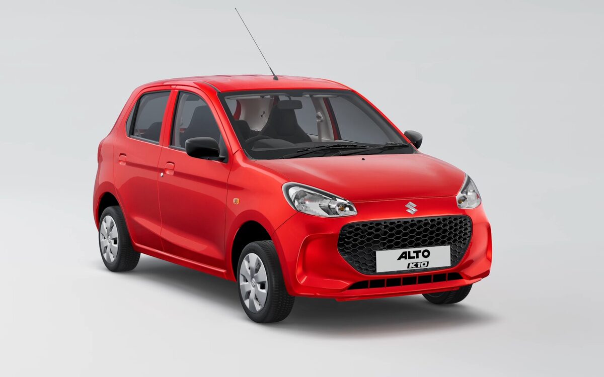 Maruti Suzuki Alto K10 in red, front three-quarter view on a plain studio background