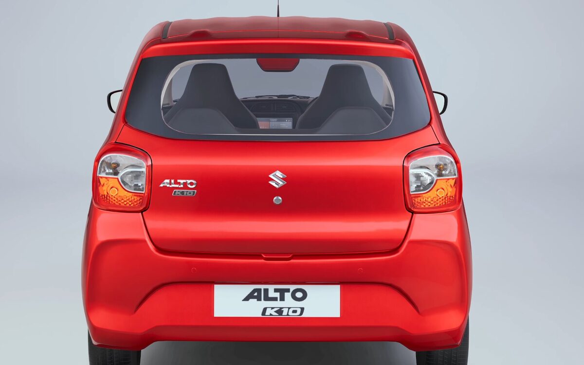 Alto K10 in red seen from directly behind, showing the tailgate and tail lamps