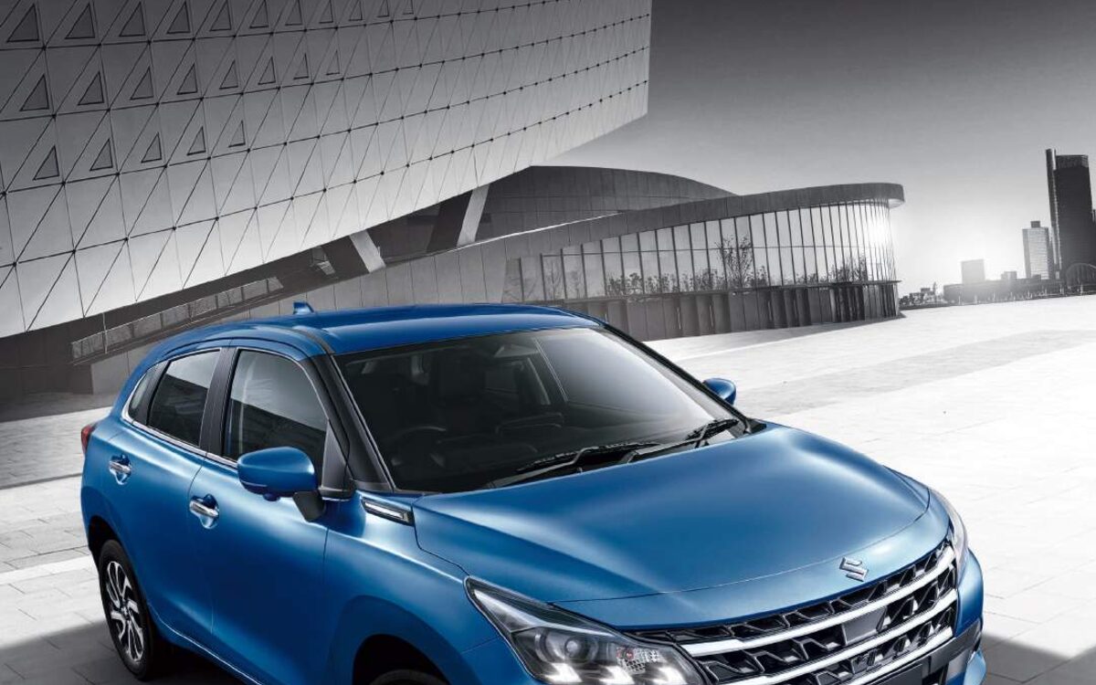 Baleno in blue seen from above at the front three-quarter angle on a tiled courtyard
