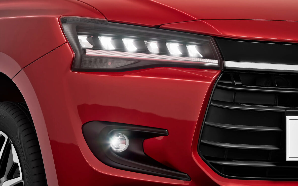 Close-up of the Dzire's LED headlamp, fog lamp and front grille edge